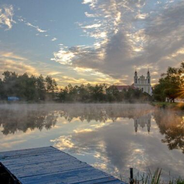 Lake and church in Belarus, trip planner and reasons to visit Belarus