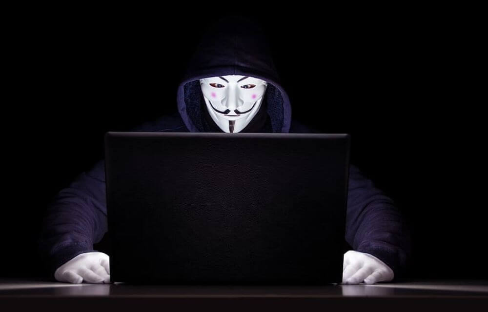anonymous hacker trying to use your personal data for data breach, cybersecurity threat