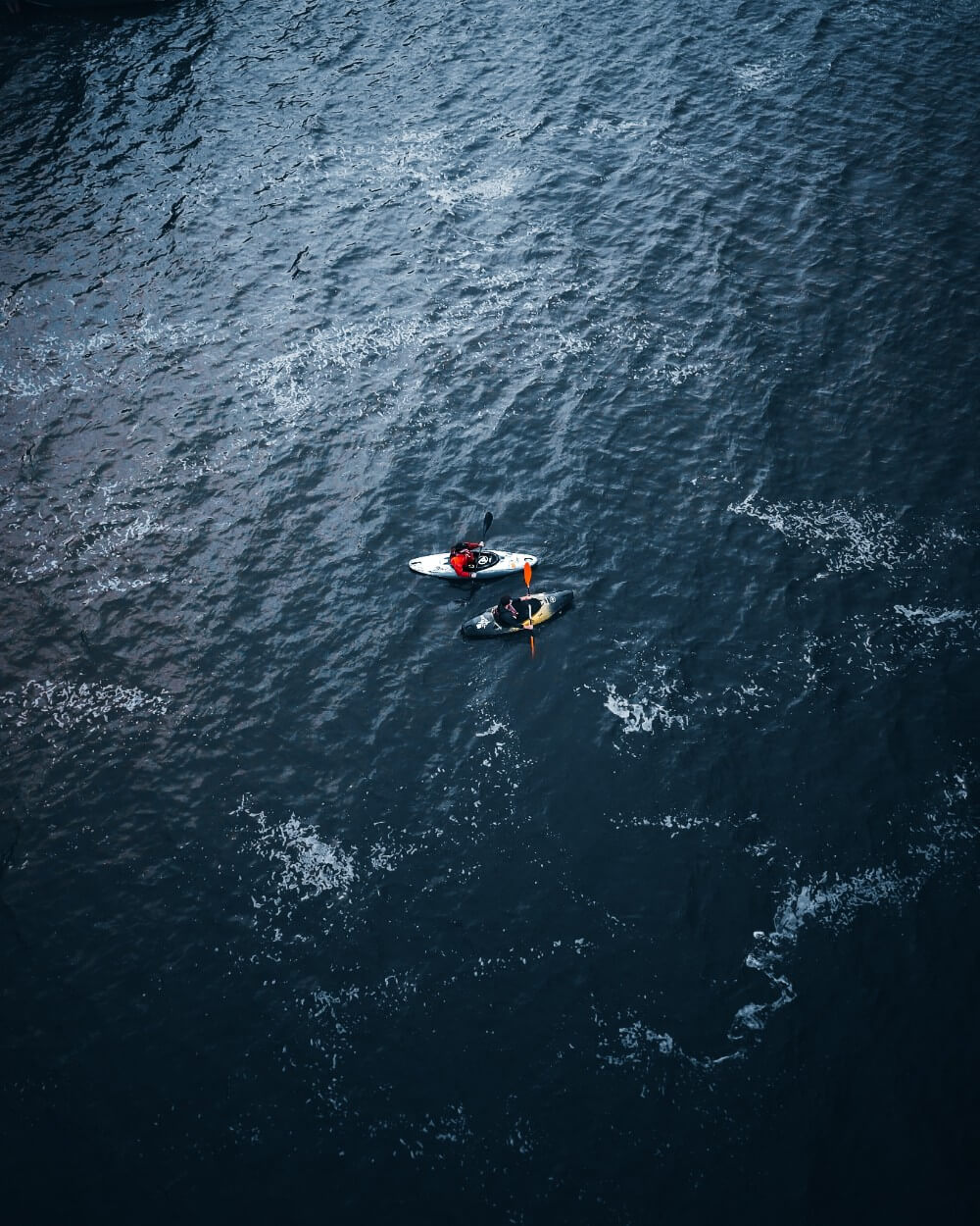 People kayaking in a lake in Belarus, drone view