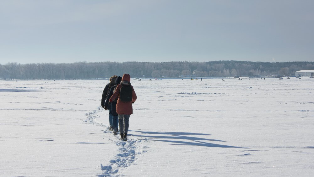 Panoramic view of nature in winter in Belarus, people walking in snow